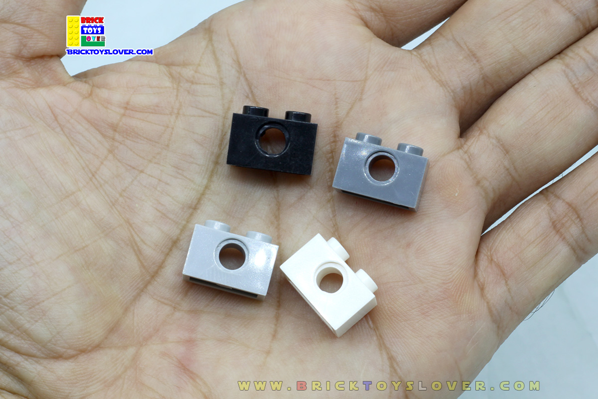 BTN012 บล็อก 1x2 ปุ่มแบบมีรูกลมตรงกลาง แพ็ค 100 กรัม 131 ชิ้น