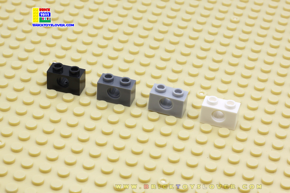 BTN012 บล็อก 1x2 ปุ่มแบบมีรูกลมตรงกลาง แพ็ค 100 กรัม 131 ชิ้น